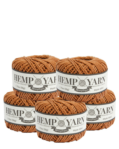 Four skeins of brown hemp yarn with labels on a white background